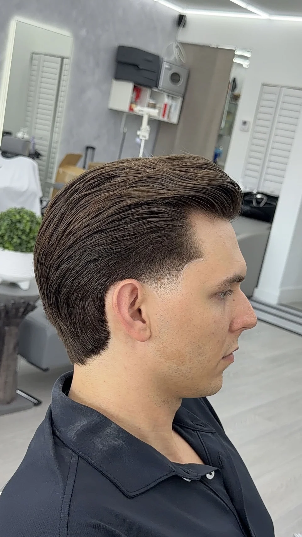 A classic scissor cut with a swept-back, styled top